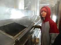 Tyler shows the hundreds of gallons of sap the evaporator can hold