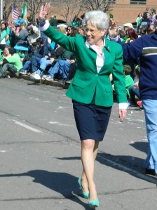 Lt. Gov Nancy Wyman waves to the crowds - note her signature high. high heels in green!