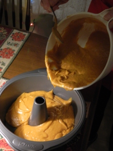 Pouring "Candy's Pumpkin Cake" batter.