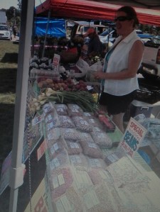 Susan Comter shown at the Newmarket Farmers Market in coastal New Hampshire that features local growers, food producers, craftsmen and businesses.
